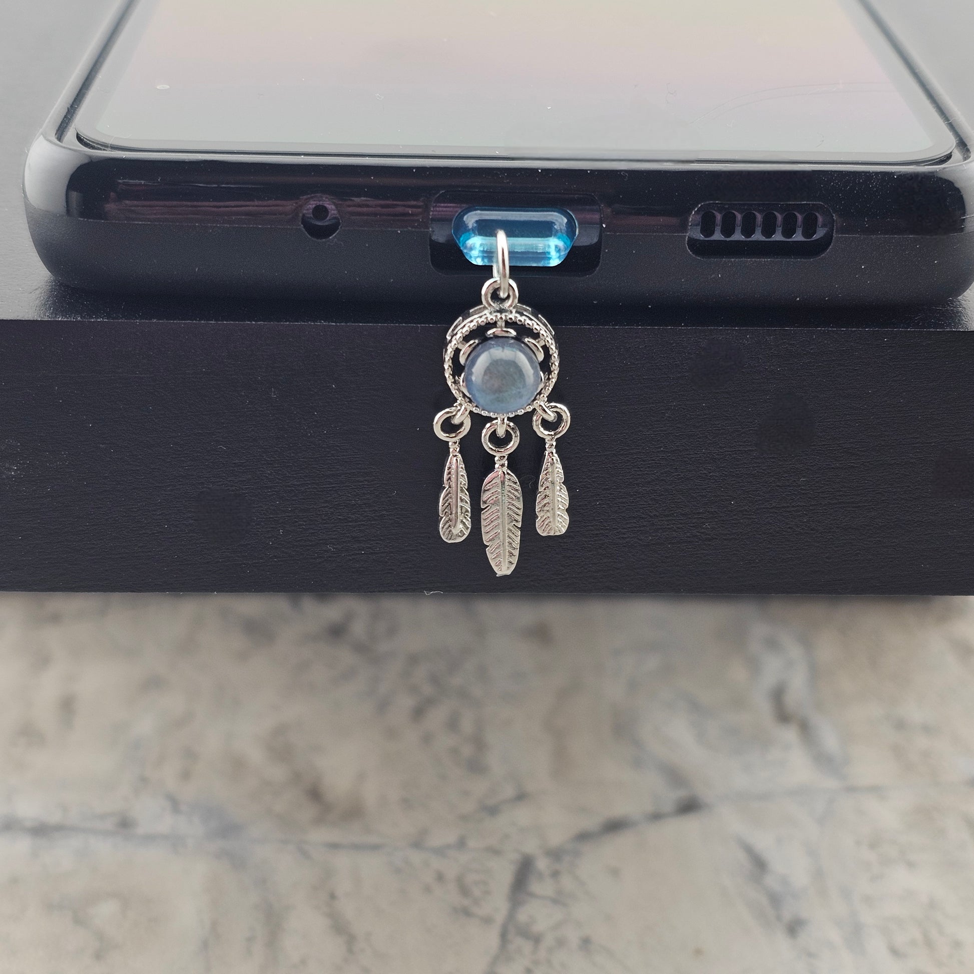 Shows how a version of a charm will look on the phone case