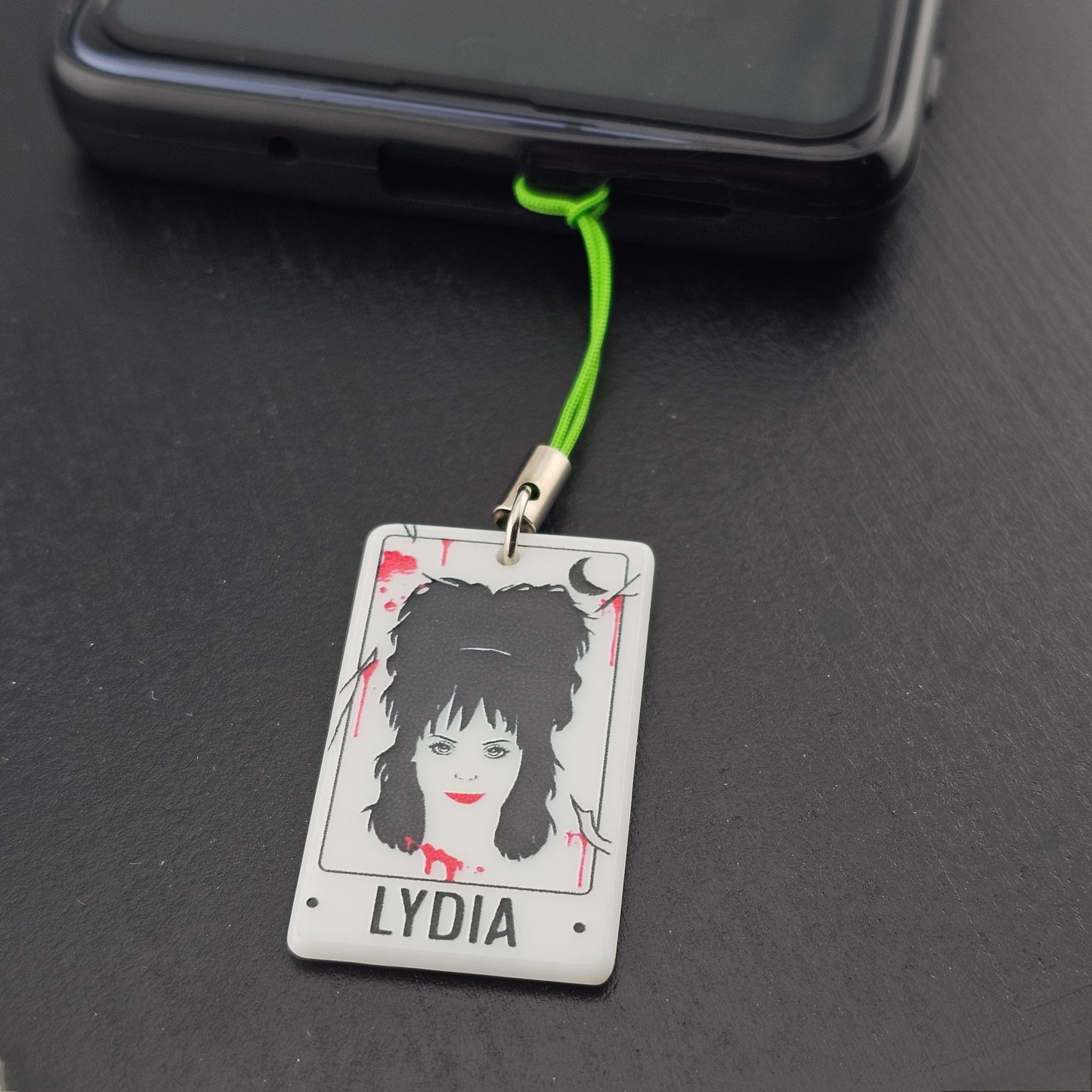 Shows how a cord charm would look on a phone case