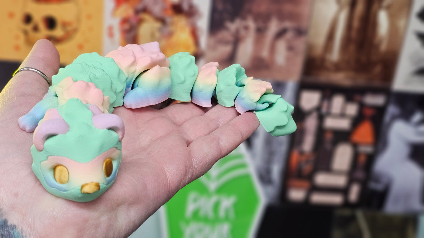 Rainbow Articulated Ferret – 3D Printed Flexible Toy with Gold Eyes