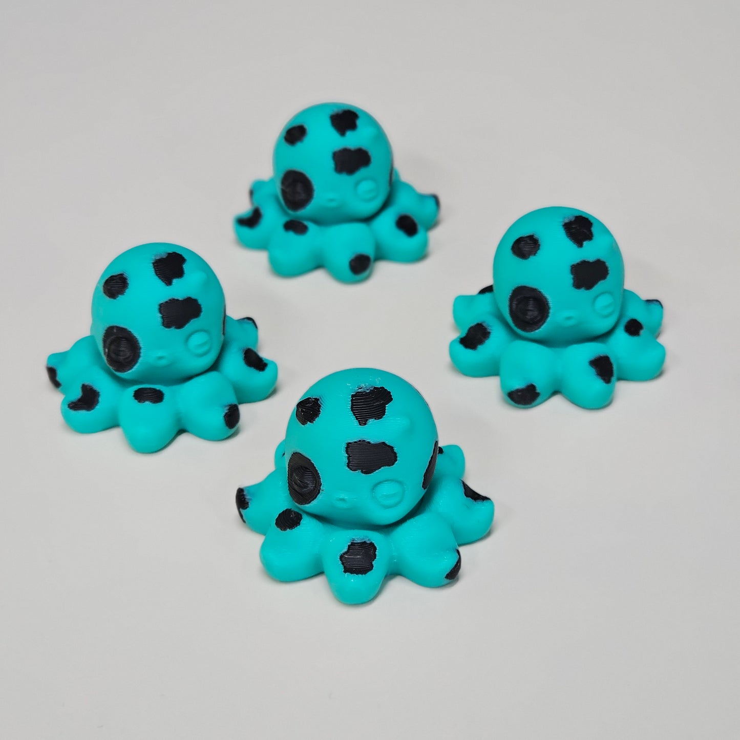 Spotted Like a Cow Octo Spinner – Turquoise & Black 3D Printed Fidget