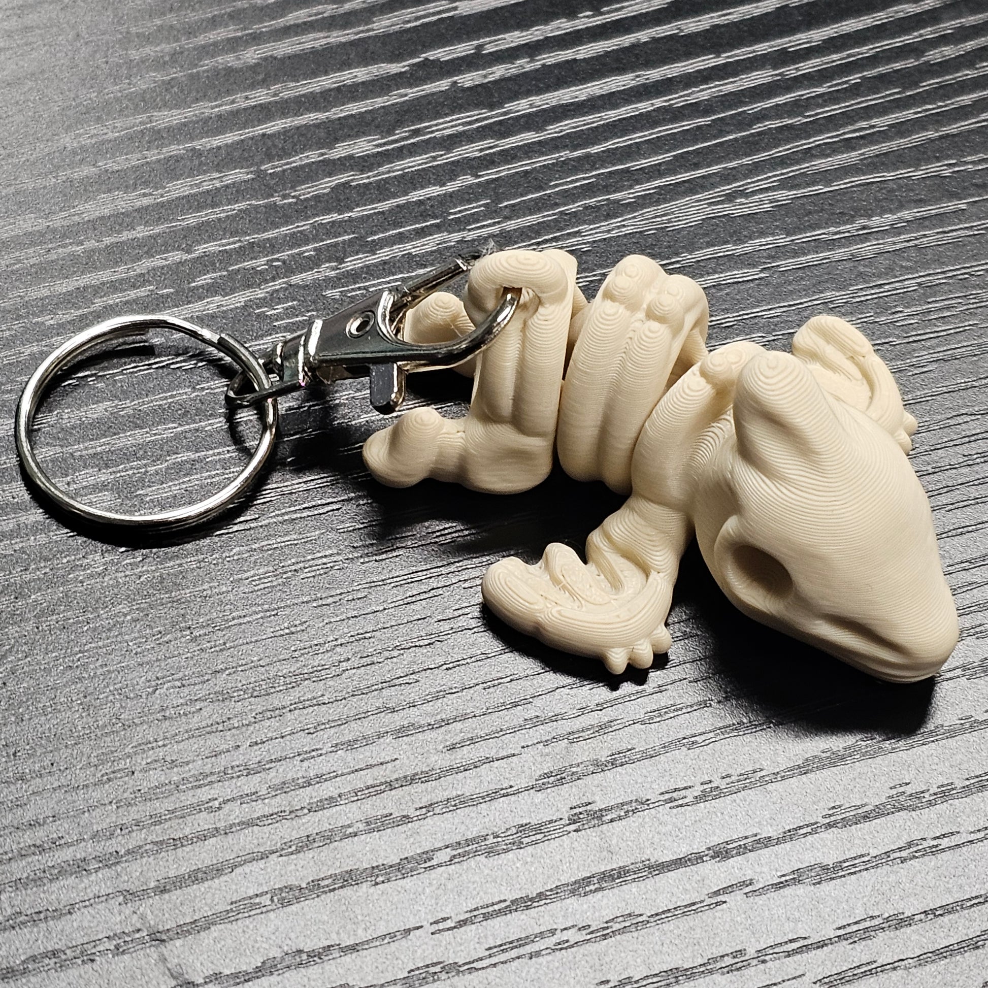 Keychain of a bone shaped dinosaur