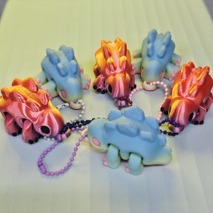 Articulated Chubby Dino Keychain – Flame or Cotton Candy