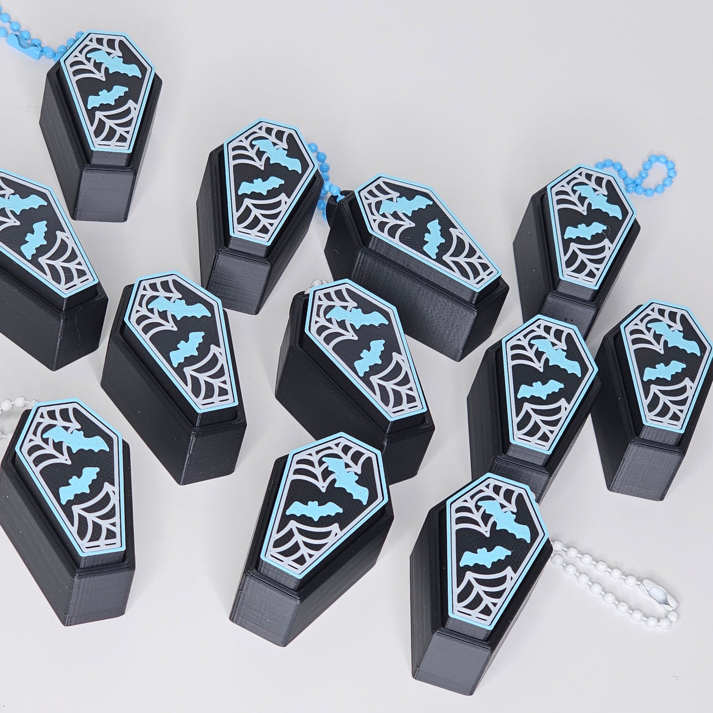 photo of coffin clicker keychains laid out