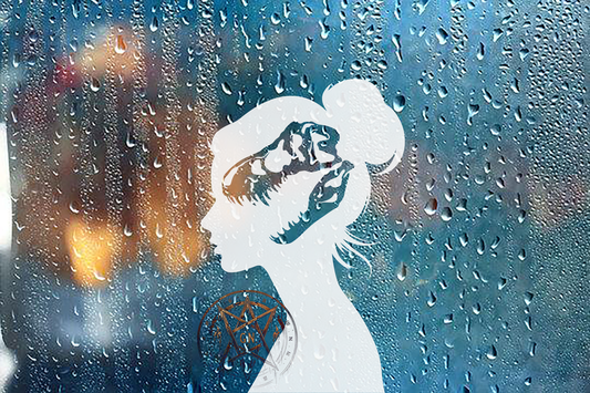 Window decal of a female silhouette with a dinosaur skull shape cut out in her head.  