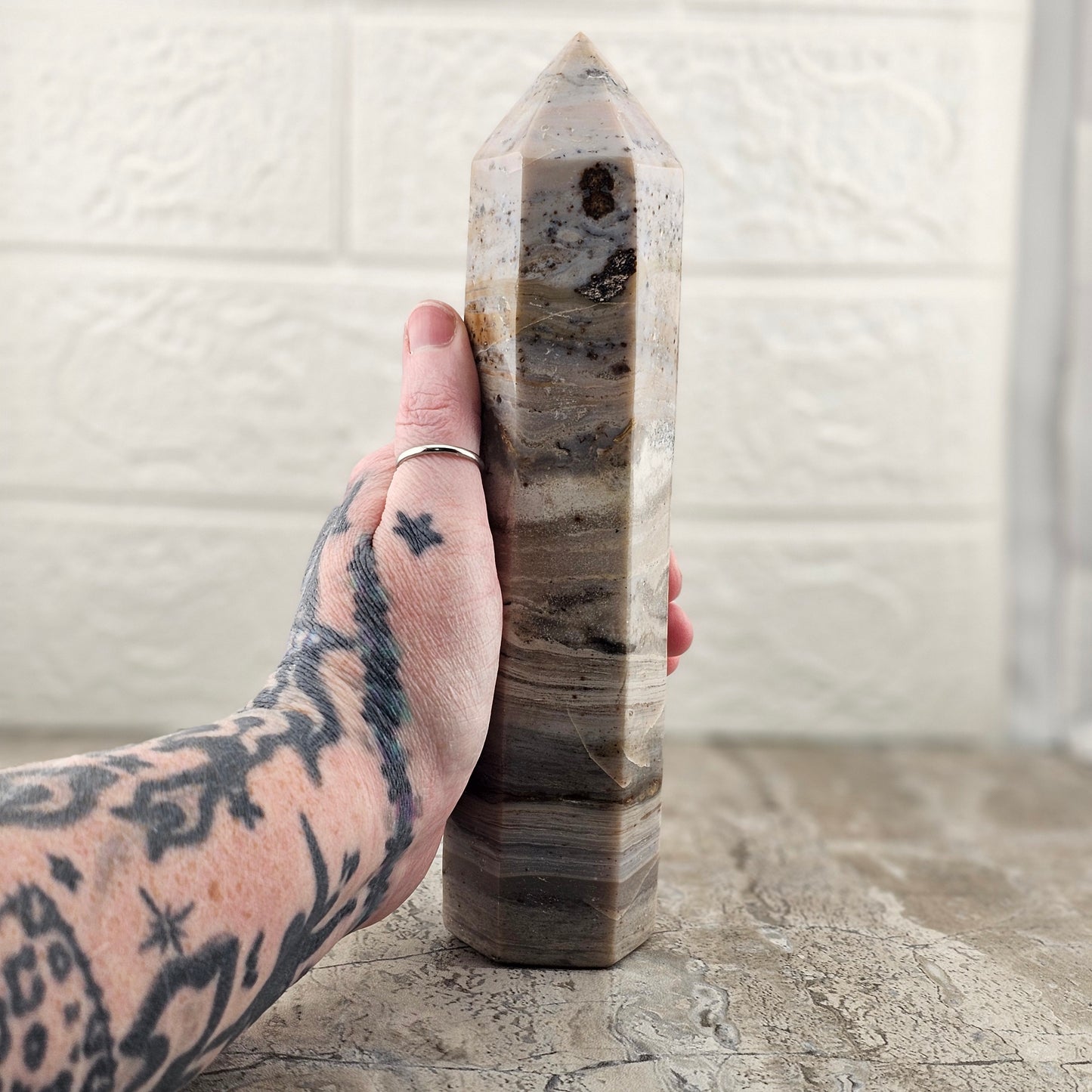 Banded Agate Stone Tower - Holding the tower showing the height