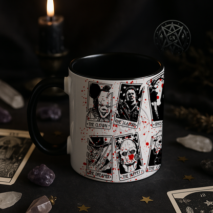 11oz Killer Tarot Mug sitting on a table with a dark background.
