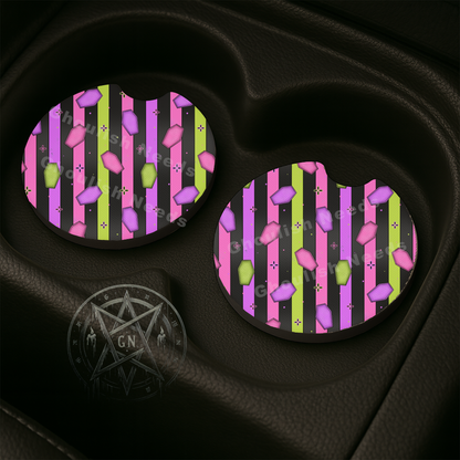 Neon Coffin and Stripes Car Coasters sitting in car coaster spots