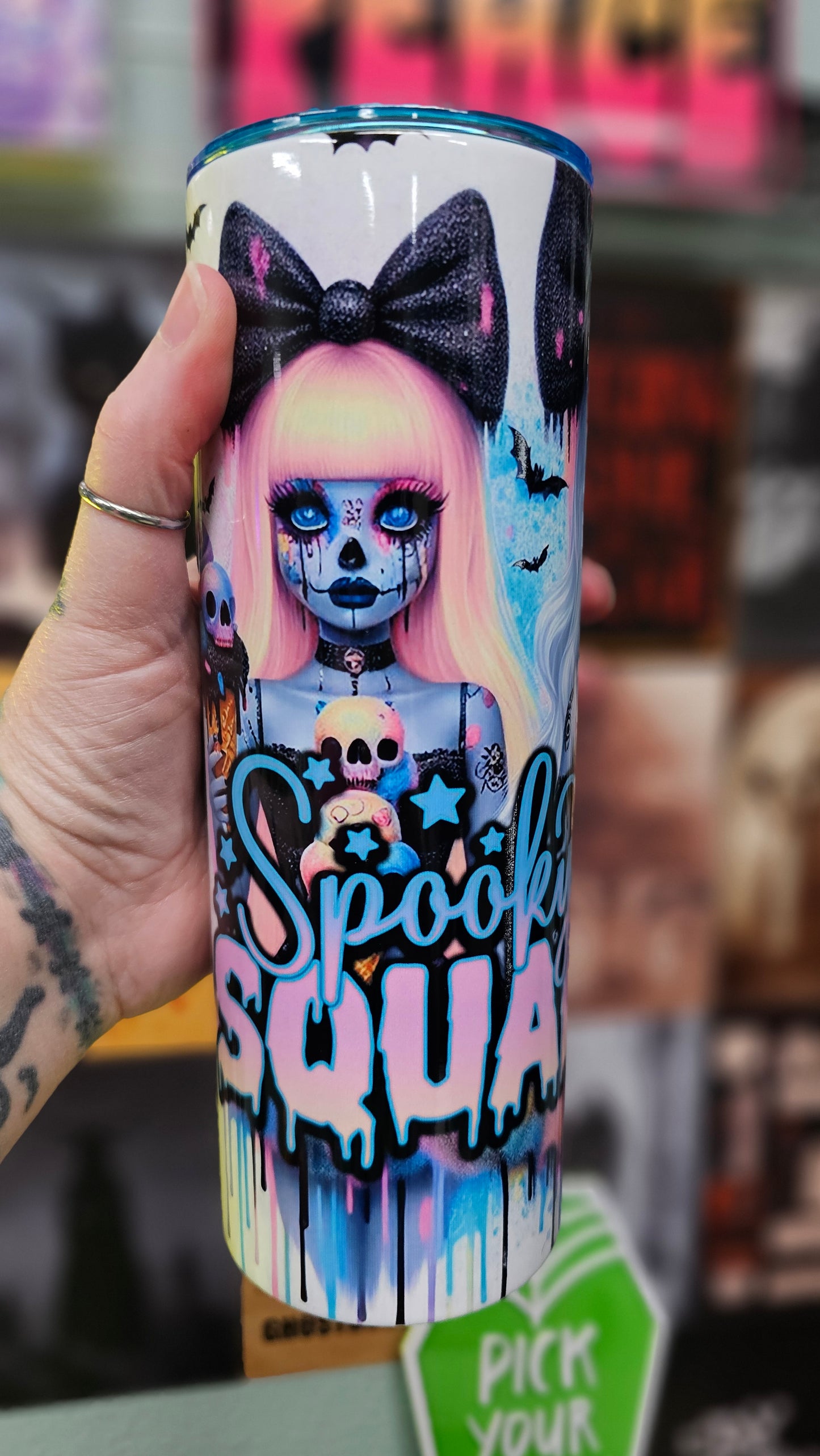 Spooky Squad - double insulated 20oz tumbler holding it in hand.