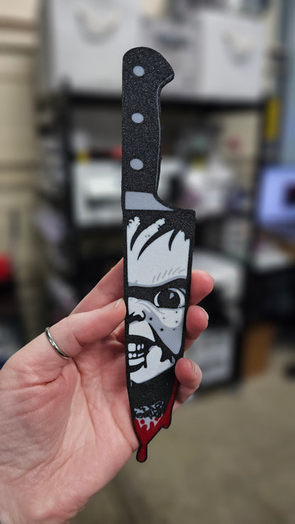 Mystery horror character knives packaging with knives and question marks on a dark background