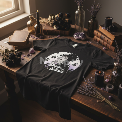 Strange and Unusual black t-shirt styled on wooden table with gothic boho decor