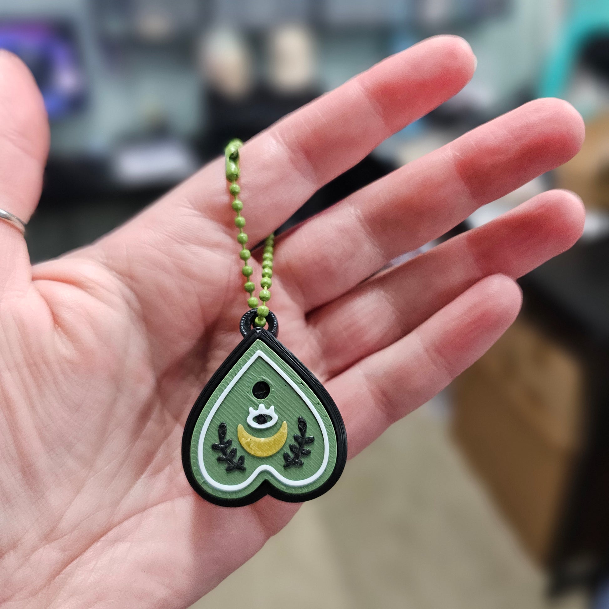 single planchette clicker being held