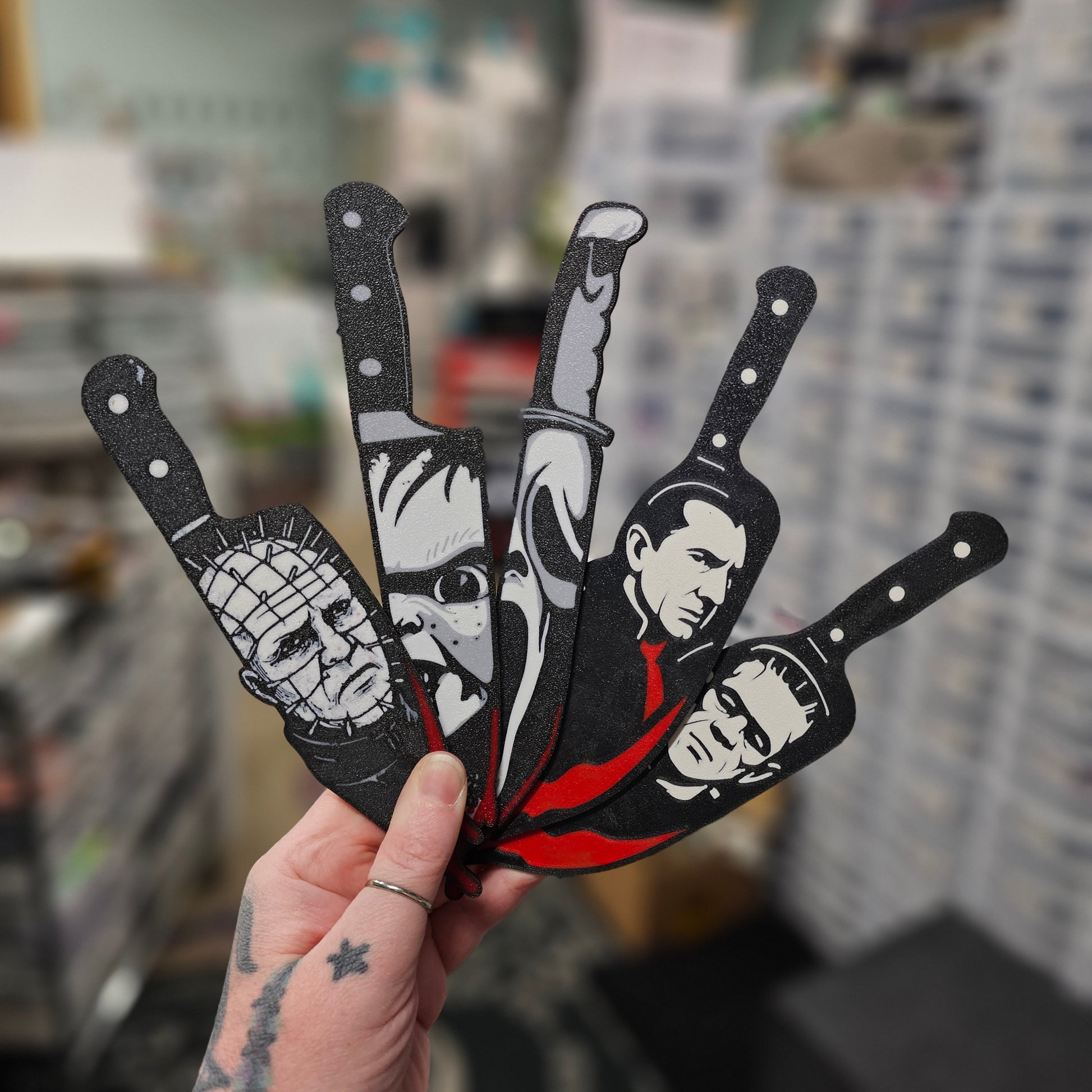 Mystery horror character knives packaging with knives and question marks on a dark background