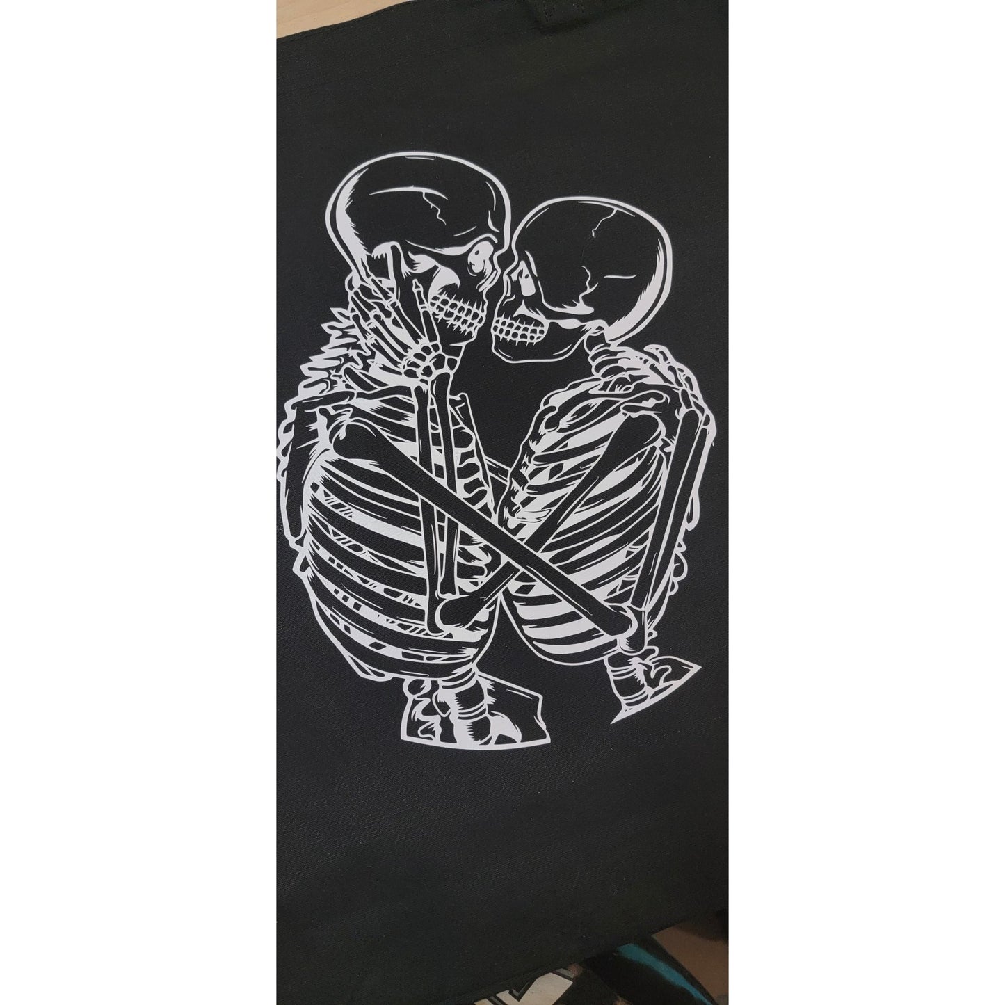Lovers Tote Bag mockup - Skeleton couple embracing on black canvas